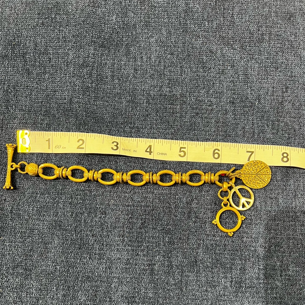 Fossil bronze color charm bracelet
